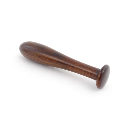 1129 - Treen : A 19thC lignum vitae snuff pestle and mortar of tapering form. Mortar approx. 4 1/4