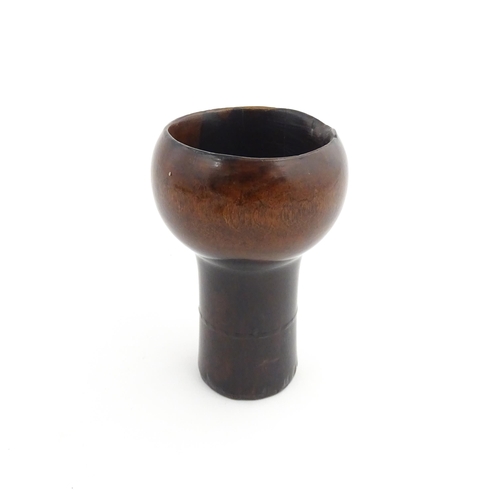 1129 - Treen : A 19thC lignum vitae snuff pestle and mortar of tapering form. Mortar approx. 4 1/4