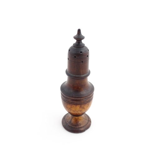 1132 - Treen : A 19thC turned wooden muffineer. Approx. 6 1/2