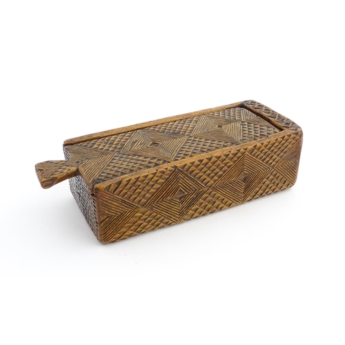 1133 - Treen : A 19thC folk art chip carved box with geometric detail and sliding top. Approx. 8 1/4