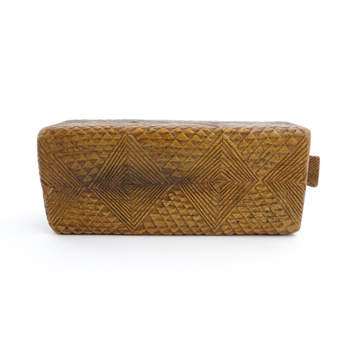 1133 - Treen : A 19thC folk art chip carved box with geometric detail and sliding top. Approx. 8 1/4