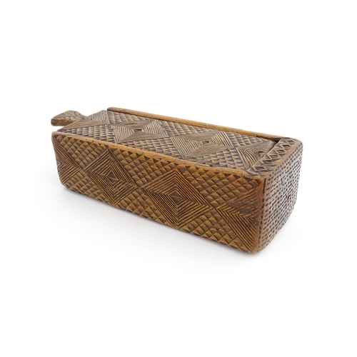 1133 - Treen : A 19thC folk art chip carved box with geometric detail and sliding top. Approx. 8 1/4