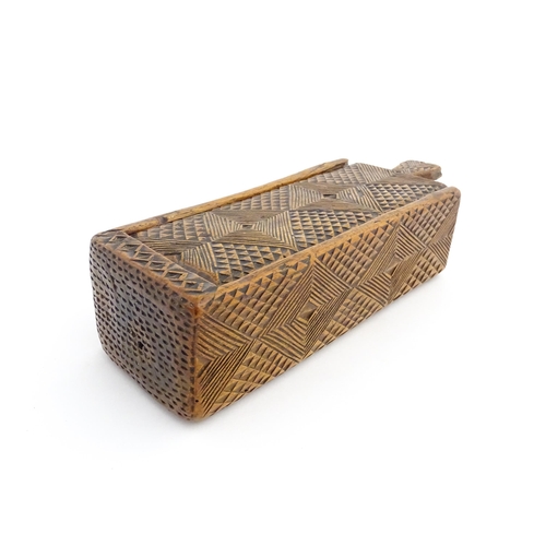 1133 - Treen : A 19thC folk art chip carved box with geometric detail and sliding top. Approx. 8 1/4