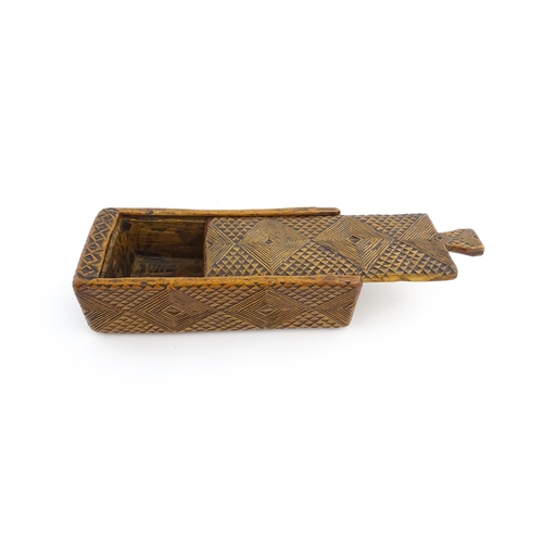 1133 - Treen : A 19thC folk art chip carved box with geometric detail and sliding top. Approx. 8 1/4