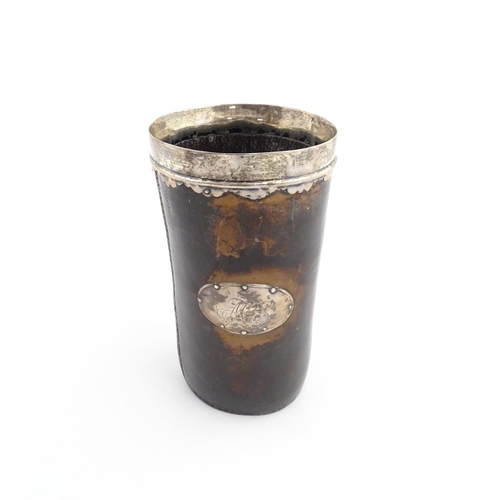 1136 - A George III leather and silver mounted beaker, the silver rim with scallop edge. Approx. 6 3/4