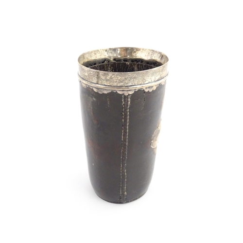 1136 - A George III leather and silver mounted beaker, the silver rim with scallop edge. Approx. 6 3/4