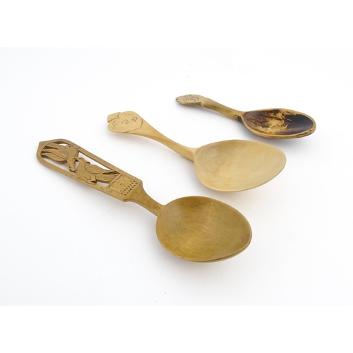 1143 - Treen : Three carved spoons, to include a Scandinavian example, one with carved Asiatic pheasant det... 