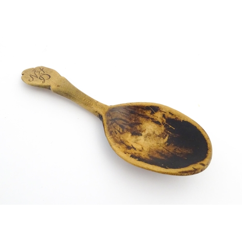 1143 - Treen : Three carved spoons, to include a Scandinavian example, one with carved Asiatic pheasant det... 