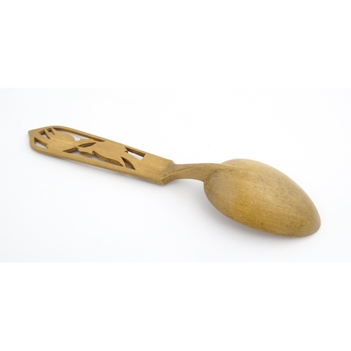 1143 - Treen : Three carved spoons, to include a Scandinavian example, one with carved Asiatic pheasant det... 