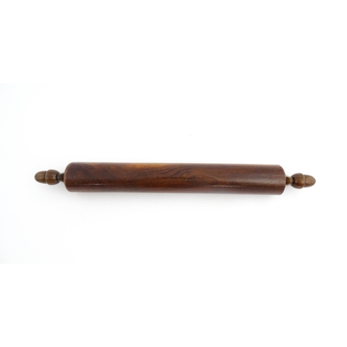 1145 - Treen : A 19thC rolling pin with turned acorn formed handles. Approx. 18