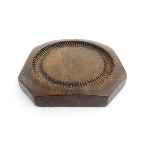 1148 - Treen : A 19thC treen shortbread biscuit mould of octagonal form. Approx. 9 3/4