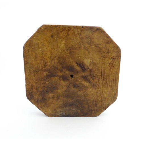 1148 - Treen : A 19thC treen shortbread biscuit mould of octagonal form. Approx. 9 3/4