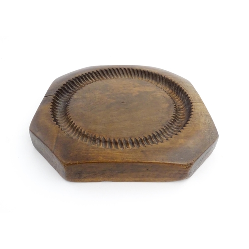 1148 - Treen : A 19thC treen shortbread biscuit mould of octagonal form. Approx. 9 3/4