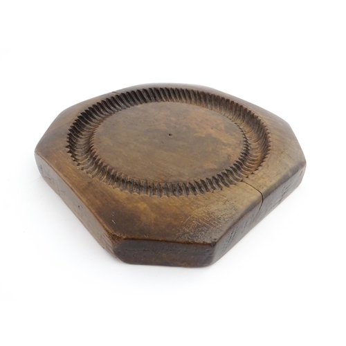 1148 - Treen : A 19thC treen shortbread biscuit mould of octagonal form. Approx. 9 3/4