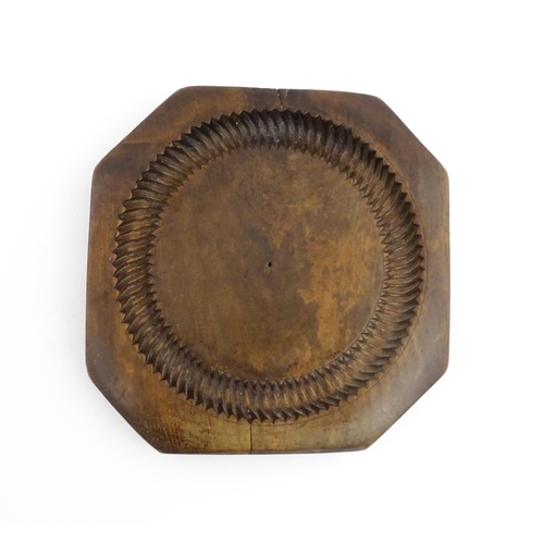 1148 - Treen : A 19thC treen shortbread biscuit mould of octagonal form. Approx. 9 3/4