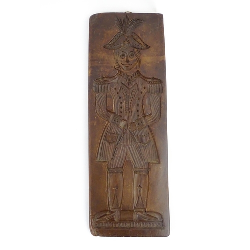 1155 - Treen : A large 19th Continental carved fruitwood gingerbread biscuit / cookie mould depicting a Dut... 