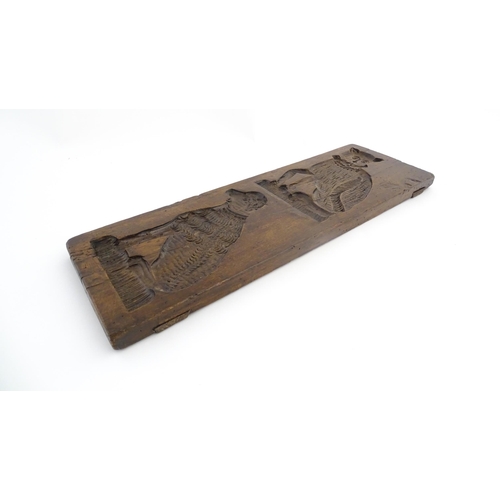 1156 - Treen : A 19thC folk art carved fruitwood gingerbread biscuit / cookie mould depicting a seated cat ... 