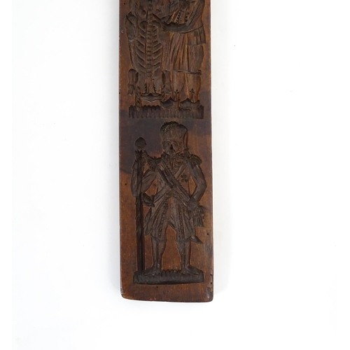 1157 - Treen : A 19thC Continental double sided carved fruitwood gingerbread biscuit / cookie mould with fi... 