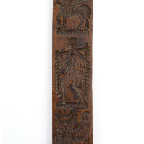 1157 - Treen : A 19thC Continental double sided carved fruitwood gingerbread biscuit / cookie mould with fi... 