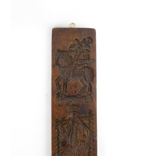 1157 - Treen : A 19thC Continental double sided carved fruitwood gingerbread biscuit / cookie mould with fi... 