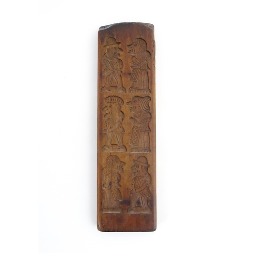 1158 - Treen : A 19thC carved gingerbread biscuit / cookie mould depicting Punch and Judy figures. Approx. ... 