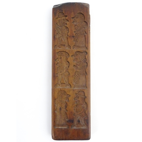 1158 - Treen : A 19thC carved gingerbread biscuit / cookie mould depicting Punch and Judy figures. Approx. ... 