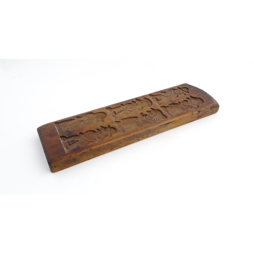 1158 - Treen : A 19thC carved gingerbread biscuit / cookie mould depicting Punch and Judy figures. Approx. ... 