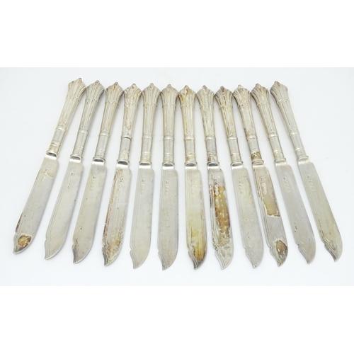 446 - A twelve place set of Victorian silver Albany pattern fish eaters comprising 12 knives and forks hal... 