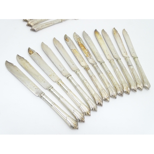 446 - A twelve place set of Victorian silver Albany pattern fish eaters comprising 12 knives and forks hal... 