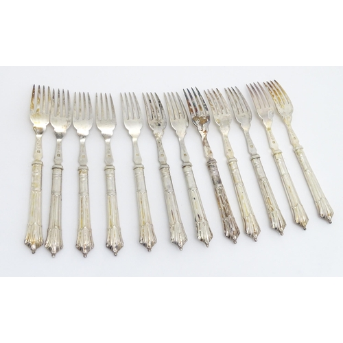 446 - A twelve place set of Victorian silver Albany pattern fish eaters comprising 12 knives and forks hal... 