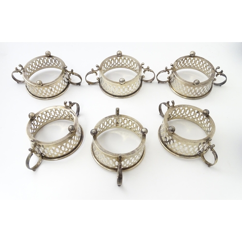 479 - A set of six Canadian silver twin handled cruet / coaster frames with pierced detail, marked under B... 