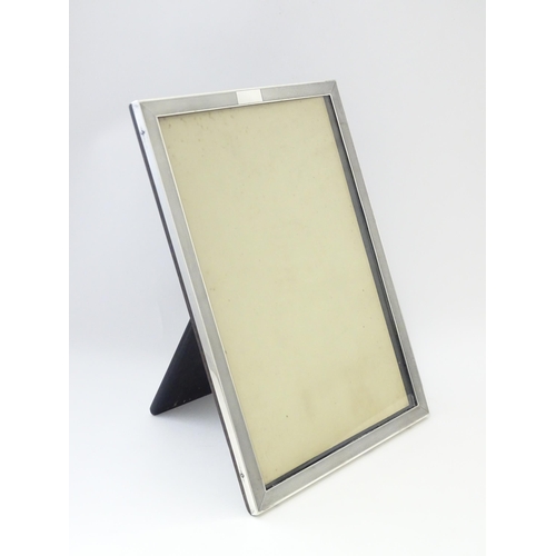 480 - An easel back photograph frame with silver surround hallmarked Birmingham 1936, maker Charles S. Gre... 