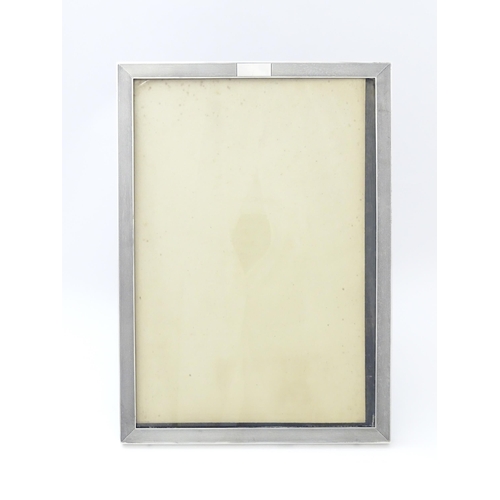 480 - An easel back photograph frame with silver surround hallmarked Birmingham 1936, maker Charles S. Gre... 