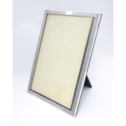 480 - An easel back photograph frame with silver surround hallmarked Birmingham 1936, maker Charles S. Gre... 