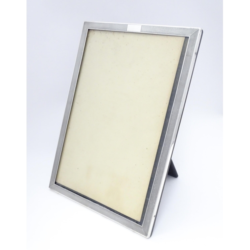 480 - An easel back photograph frame with silver surround hallmarked Birmingham 1936, maker Charles S. Gre... 