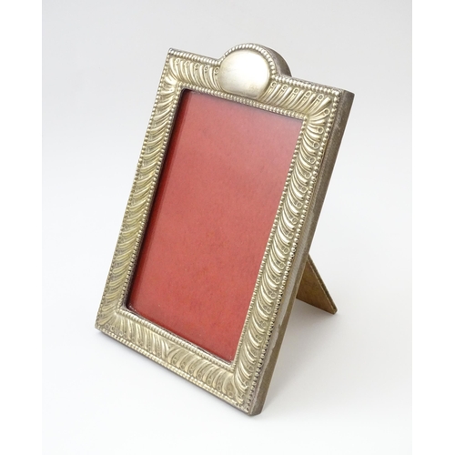 485 - An easel back photograph frame with silver surround hallmarked London 2011, maker Highfield Frames. ... 