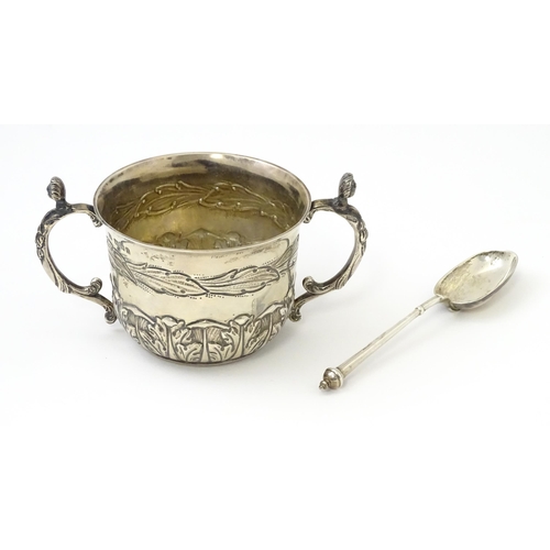 492 - A cased silver Christening set comprising twin handled bowl / porringer and spoon hallmarked London ... 