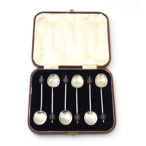 504 - A cased set of six silver coffee spoons with coffee bean finials, hallmarked Birmingham 1932, maker ... 