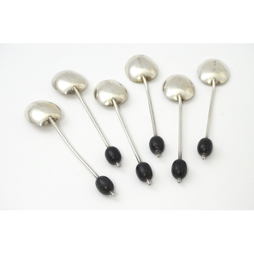 504 - A cased set of six silver coffee spoons with coffee bean finials, hallmarked Birmingham 1932, maker ... 