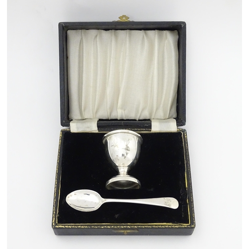 505 - A cased silver Christening set comprising egg cup and spoon hallmarked Birmingham 1944, maker Lanson... 