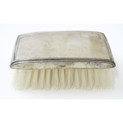 506 - A silver mounted brush with engine turned decoration hallmarked Birmingham 1986, maker Broadway & Co... 