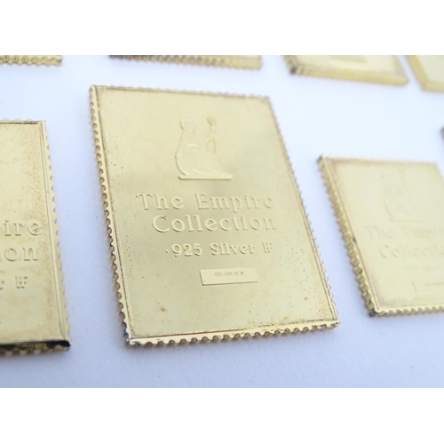 512 - The Empire Collection - A limited edition set of silver gilt replicas of British Empire postal stamp... 