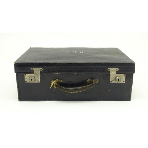 513 - A blue leather vanity case / valise containing a quantity of assorted silver topped bottles, jars, s... 