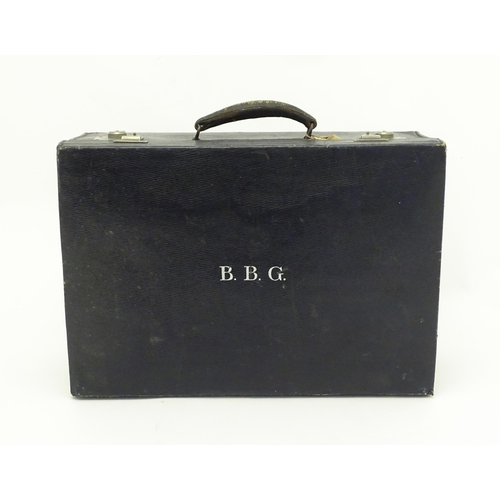 513 - A blue leather vanity case / valise containing a quantity of assorted silver topped bottles, jars, s... 