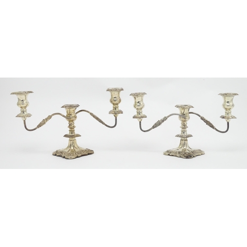 514 - A pair of silver plate three branch table candelabra / candelabrum with flora and acanthus scroll de... 