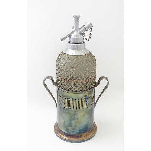 522 - An early 20thC soda siphon with silver plate stand. Approx. 15