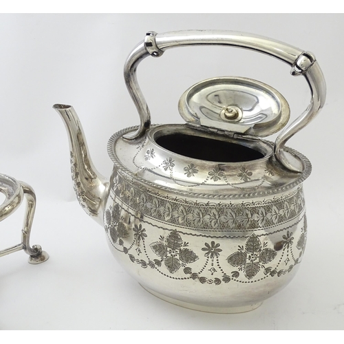 527 - A quantity of silver plated wares to include egg cruet, kettle on stand, spoons, bottle coaster etc.... 