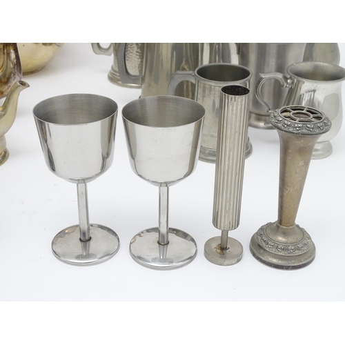 528 - A quantity of assorted silver plate, pewter and base metal wares to include goblets, tankards, cruet... 