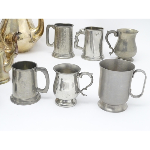 528 - A quantity of assorted silver plate, pewter and base metal wares to include goblets, tankards, cruet... 