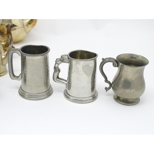 528 - A quantity of assorted silver plate, pewter and base metal wares to include goblets, tankards, cruet... 